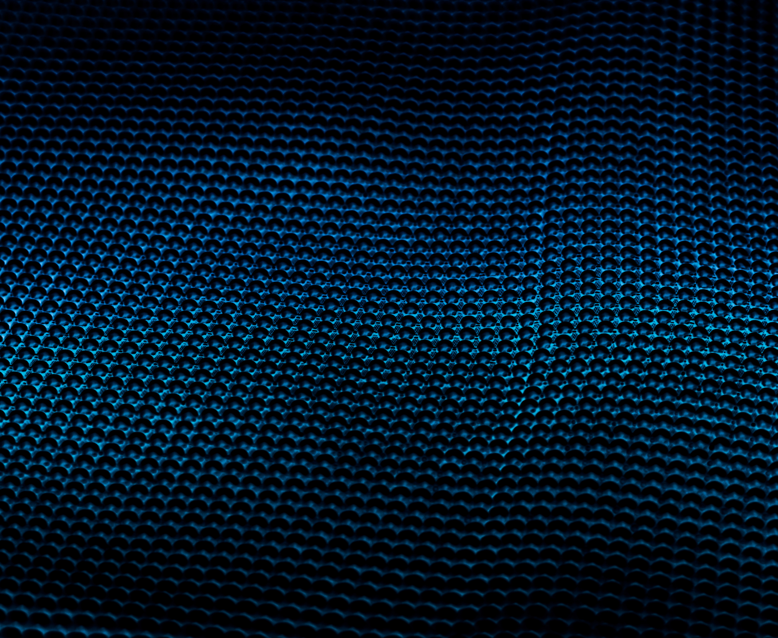 Close-up of a dark blue textured metal surface